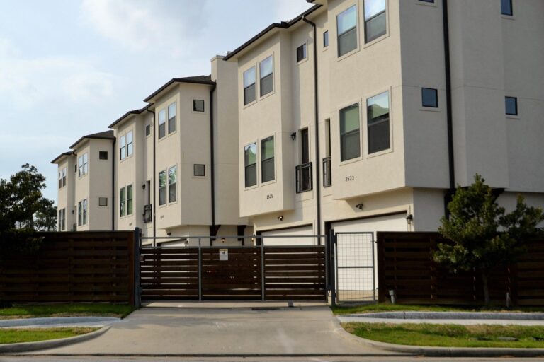 real-estate, for rent, rented, driveway, gated community, duplex, residential, architecture, outdoors, house, facade, building, window, street, pavement, nature, daylight, sky, exterior, apartment, town, home, estate, real, modern, property, design, housing, structure, residence, set, collection, townhouse, rental, brown, fence, gate, grass, mowed, lawn, occupied, occupy, investment, people, real life, brokerage, dwelling, affordable, low income housing, middle class, lower class, first apartment, hotel, townhouse check point, houston, texas, check-point, rent, business, on post, security, guard, guard house, security post, post, alert, ready, safety, gates, lock-down, locked, closed, firm, real estate, street side, entrance, enter, development, apartment complex, houston texas, town house, red, black gate, gated, secured, security gate